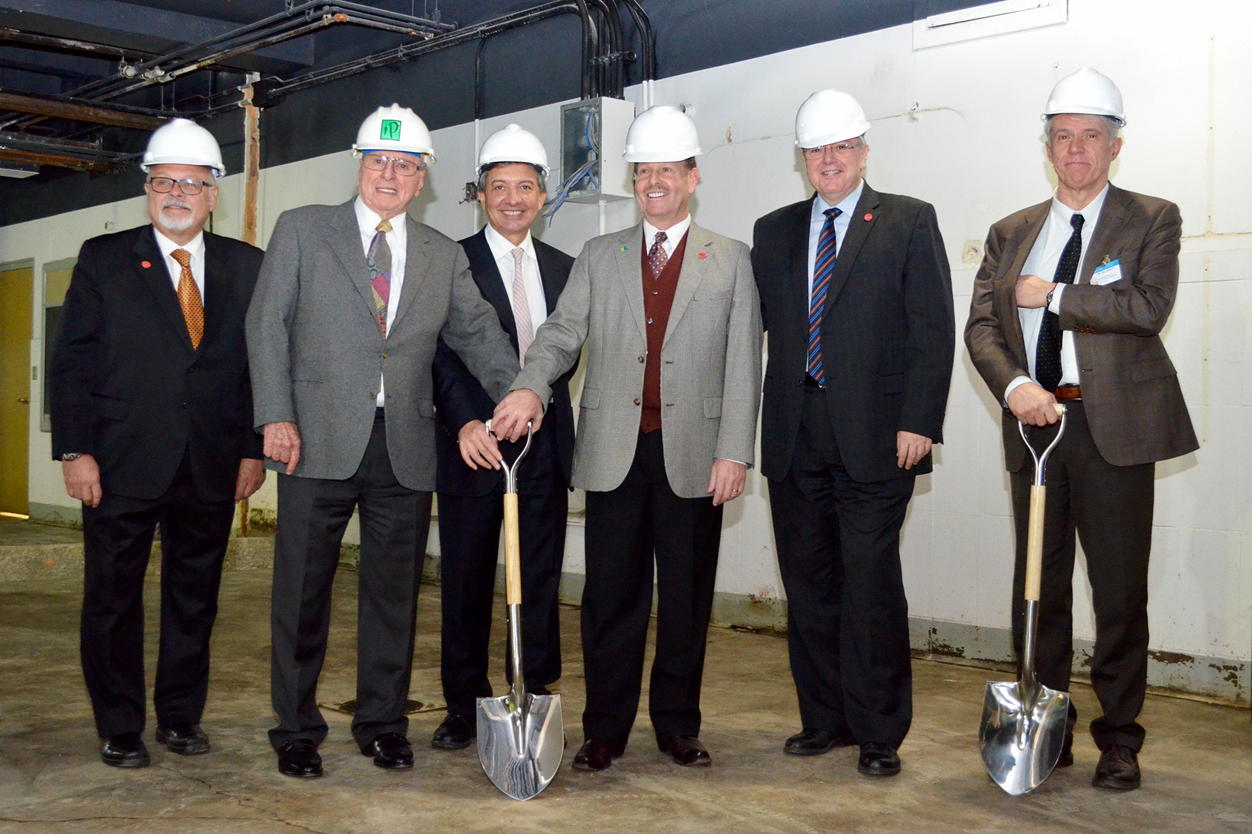 gentlemen with shovels gather for surgical, robotic center groundbreaking
                  