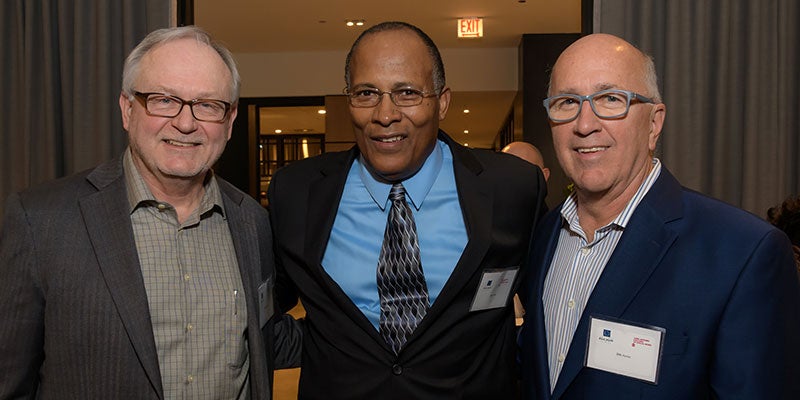 Professor James Gleeson MSW '84 (left), Jim Jones MSW '83 (middle) and donor Jim Horan MSW '79 (right) celebrate the Professor James P. Gleeson Scholarship Fund at Gleeson's retirement party in October 2017