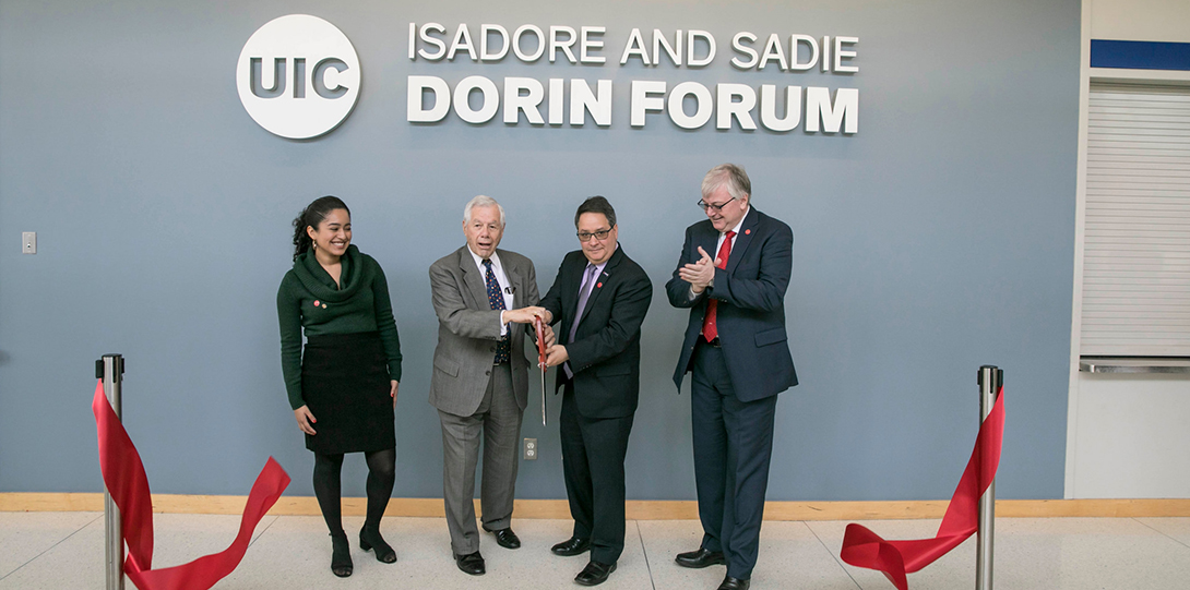 The Dorin Family with Chancellor Amiridis and student trustee Karina Reyes cut the ribbon.