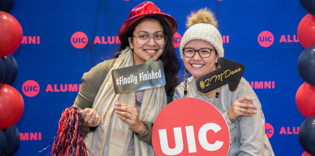 Students posing with UIC sign