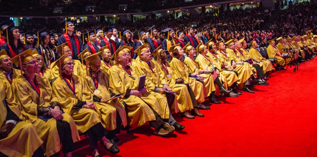 Graduates in golden gowns