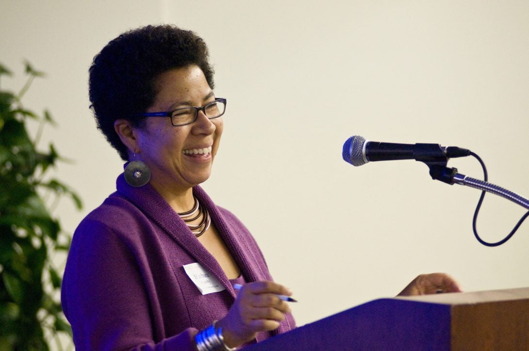 Barbara Ransby at podium smiling