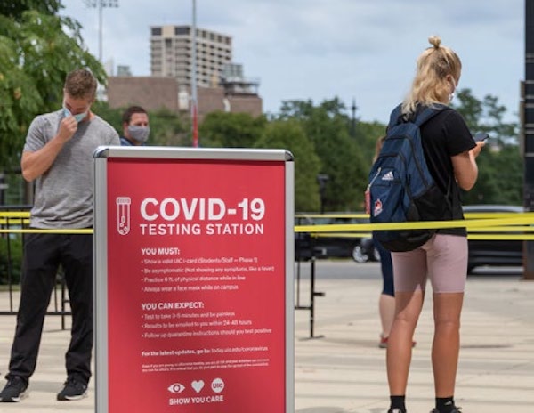 Student-athletes and Athletics staff line up for COVID-19 testing