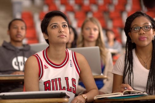 Students in a lecture hall listening to the professsor