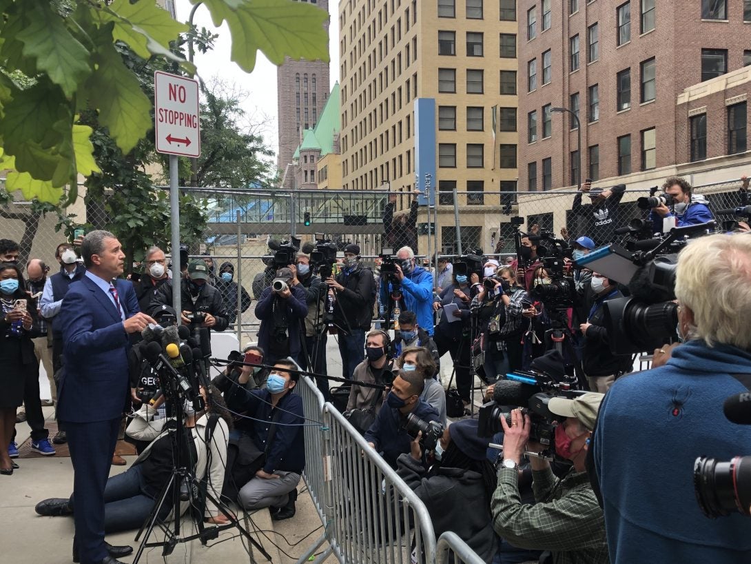 man talking to press